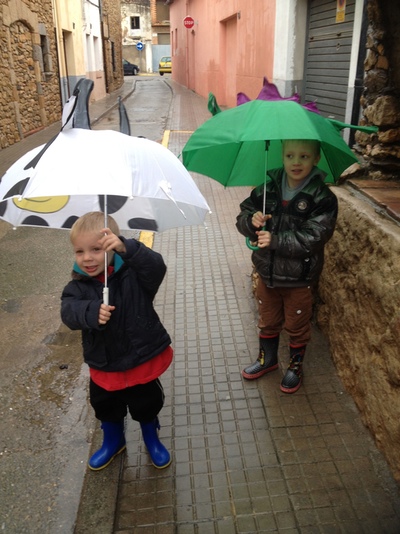 2 boys in wellies and umbrellas