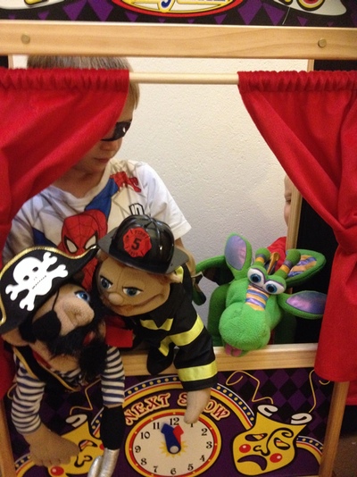 A puppet theatre and 3 puppets
