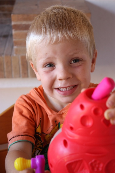 Boy paying with playdoh