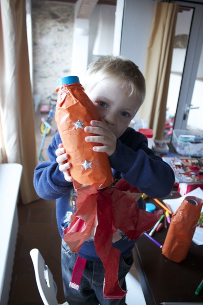 Boy holding a home made rocket