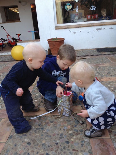 Children examining a toy