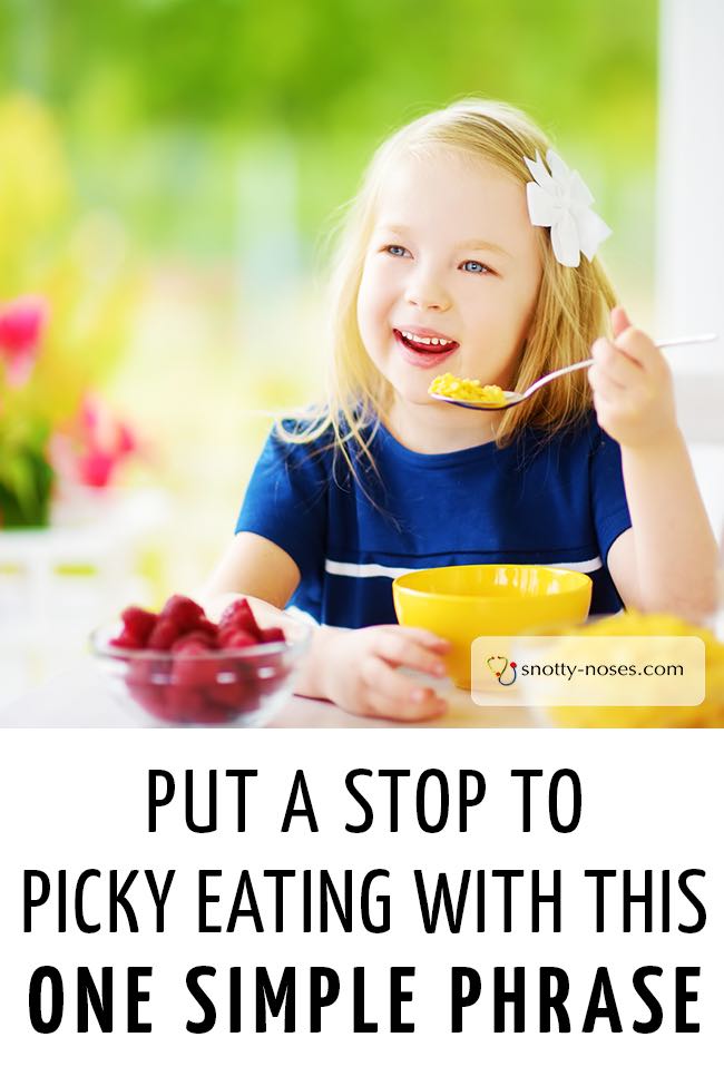 A little girl smiling as she tries new food from a yellow bowl and a plate of raspberries. #fussyeater #pickyeater #fussytoddler #fussypants #fussyeaters #healthyeatingkids 