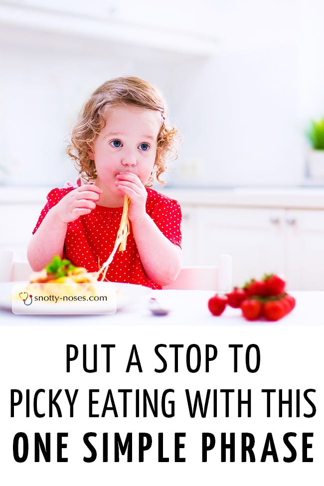 A little girl smiling as she tries new food which looks like spaghetti. #fussyeater #pickyeater #fussytoddler #fussypants #fussyeaters #healthyeatingkids 